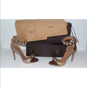Alaia bronze “bombe” sandals